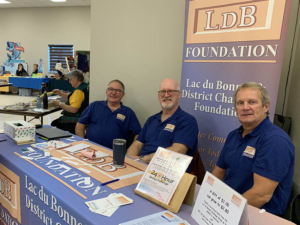 Dick Campbell (Treasurer), Kim Laurans (Board member) and Gary Rollins (President) manning the LDB Foundation booth at the Lac du Bonnet Craft Sale on November 18, 2023